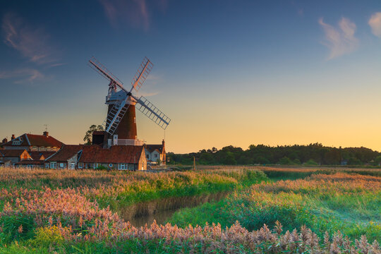 Sunset colours on Cley Windmill in the village of Cley, Norfolk, UK