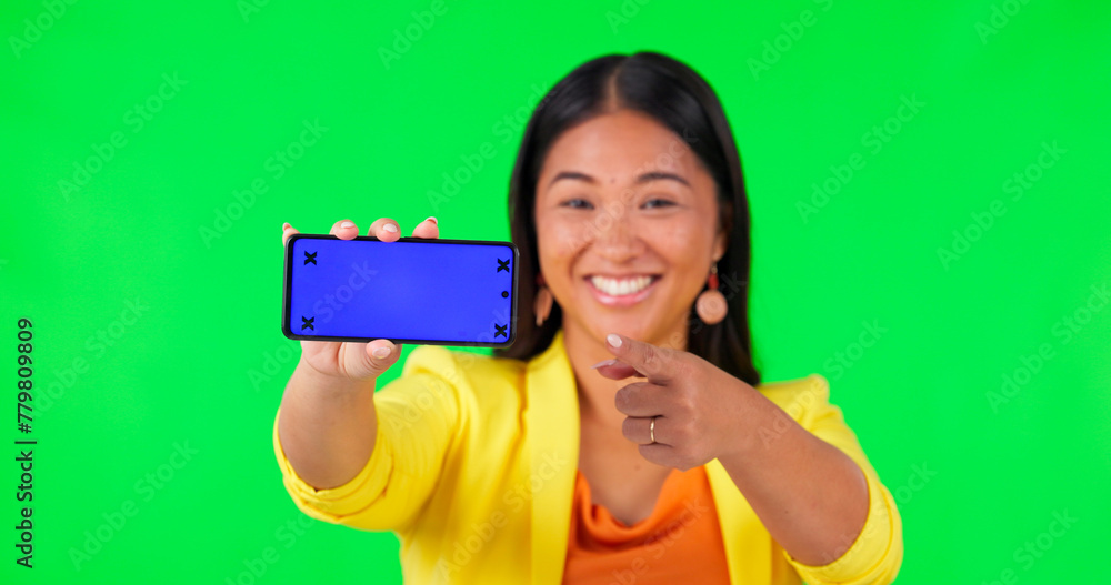 Poster woman face, green screen and hand pointing to phone mockup with tracking markers on studio backgroun