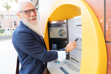 Senior man with ATM, Happy mature male using bank cash machine - Concept of business, banking...