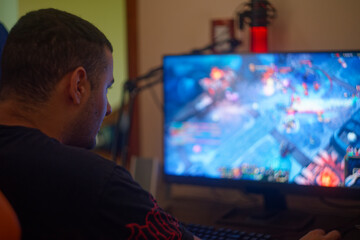 man looking at screen playing video games