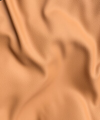 Looking down onto a piece of wrinkled tan leather close up 3d render