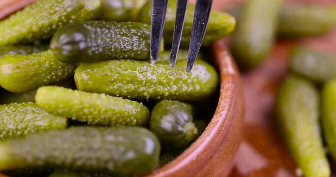 green pickled cucumbers on the table, crispy salted pickled cucumbers of small size