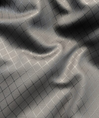 Grey modern man made fabric with a pattern 3d render
