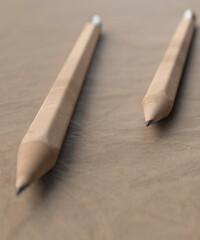 Close up of two pencils soon a piece of design paper waiting for inspiration 3d render