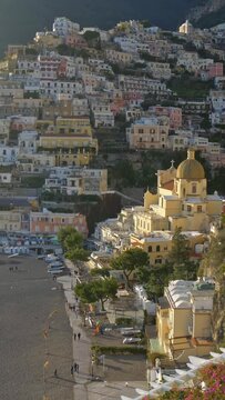 View from luxury villa to the beach and colorful houses in Positano. Positano village, Italy in the afternoon sun. Positano is a village on the Amalfi coast of Tyrrhenian Sea. Gimbal Vertical shot