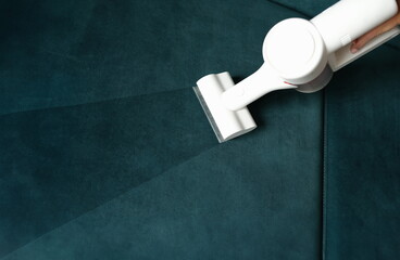 Cleaning service washing furniture with vacuum cleaner at home closeup. Cleaning service for...