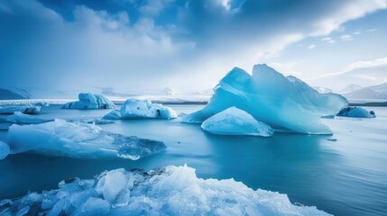 Someone walks on a frozen lake. This natural wonder is a popular tourist destination. The mountains in the background add to the majesty of the view.