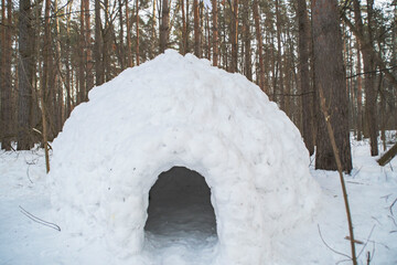 A small house made of snow. Children's igloo for games. A copy of the traditional dwelling of the inhabitants of the north.