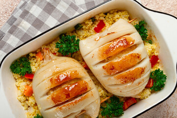 stuffed squid carcasses, baked in the oven, fried, with couscous, top view, homemade, no people,