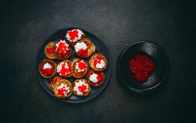 Demidoff pancakes, mini pancakes, with sour cream and red caviar, crepes. homemade, no people,