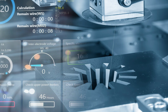 Abstract scene the wire EDM machine cutting the mold parts and graphic data background.