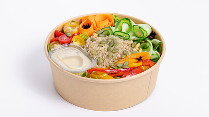 Dietetic salad with vegetables and cereals in paper bowl