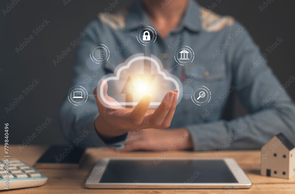 Poster businessman uses a tablet. cloud computing disk is displayed on his hand. cloud technology data stor