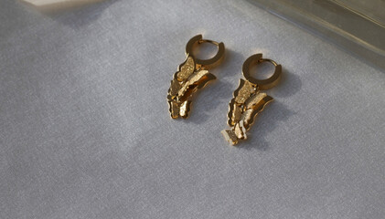 modern, lifestyle-appropriate jewellery, accessories. Yellow stainless steel, minimally shiny...