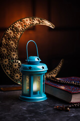 Islamic festival photo, Lantern lamp with crescent moon and Quran 