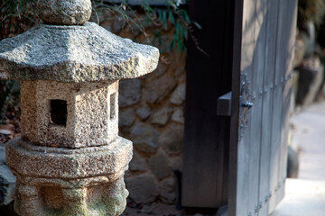 stone pagoda and wooden door