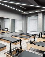 A row of Pilates machines at the gym, 