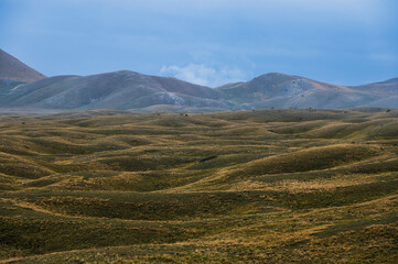 landscape inside Campo imperatore during an autumnal cloudy day, Parco nazionale del Gran Sasso, L'Aquila, Italy