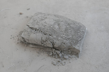 A bag of cement that hardened when exposed to water