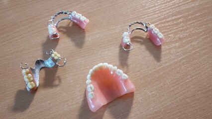 Group of dentures on the table at the dentist in the dental office