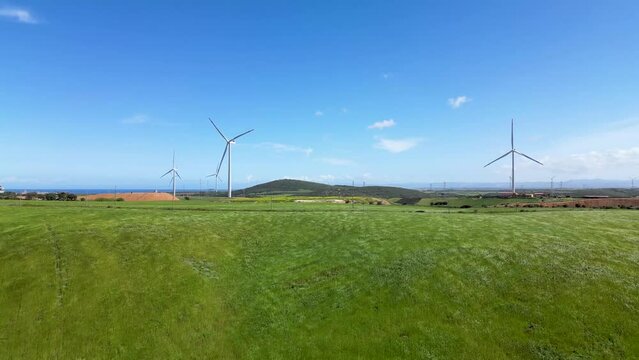 Wind farm on the picturesque hilly terrain of Sardinia.