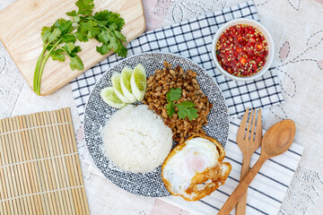 Traditional Thai street food, Fried Pork With Garlic On Rice with Egg