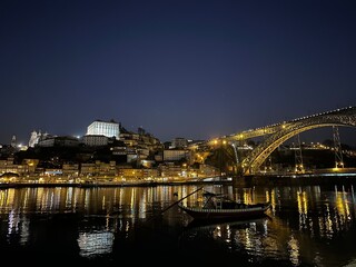 Night view of the city of Porto with Dom Luís I Bridge, Ribeira and the rabelo boat, Vila Nova de...