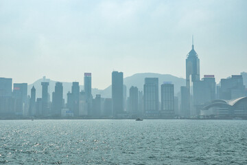 January 01, 2024: Buildings on Victoria Harbour, Hong Kong, China. People celebrating Chinese new...