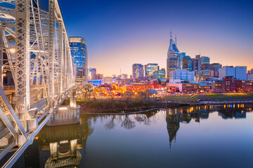 Nashville, Tennessee, USA. Cityscape image of Nashville, Tennessee, USA downtown skyline with reflection of the city the Cumberland River at spring sunset. - obrazy, fototapety, plakaty