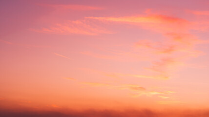 Pink sunset sky with clouds