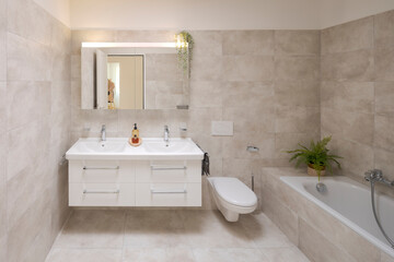 Interior of large modern bathroom with bathtub. - 779879030