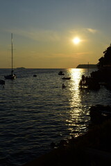 Dubrovnik, Croatia - August, 26 2021: A beautiful sunset at sunset beach at Lapad beach.
