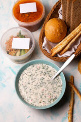 top view a plate of okroshka and fresh bread on the table