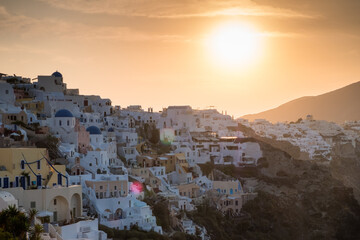 Sunset in Oia on the Greek island of Santorini - obrazy, fototapety, plakaty