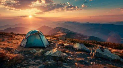 Fototapeten Camping tent at sunset in the mountains, with the soft hues of twilight casting a magical ambiance over the rugged landscape © AlfaSmart