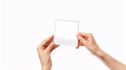 hands holding blank polaroid photo frame template