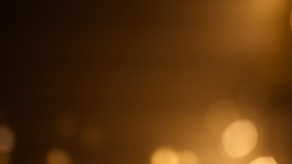 Rich brown-golden bokeh background, evoking warmth and elegance,