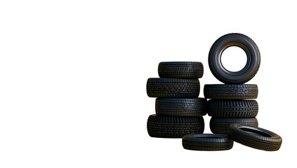 A stack of tires in various sizes and colors, set against an isolated white background