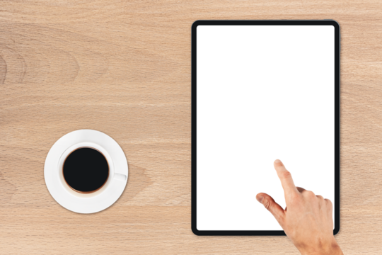 the tablet is on the wood table