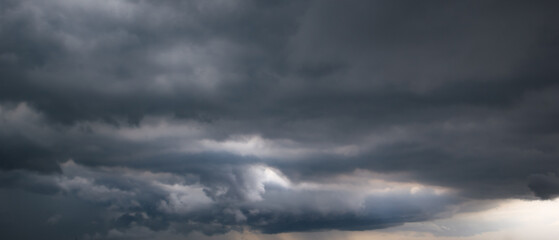 Bad or moody weather sky and environment. the dark sky with heavy clouds converging and a violent...
