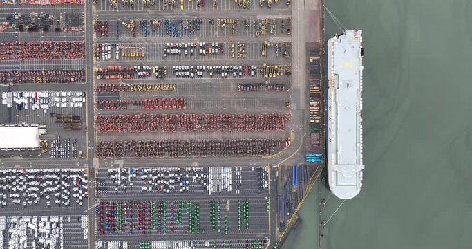 Aerial drone view of a roll-on roll-off terminal in the port of Zeebrugge, Belgium. Shipping of vehicles over seas.
