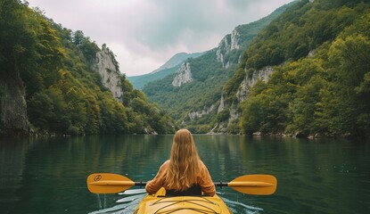 a woman in a kayak on a lake