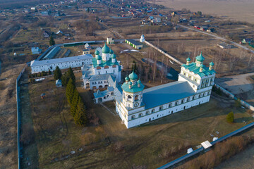 Above the temples of the ancient Nikolo-Vyazhishchi Monastery on a April day (aerial photography). Vyazhishchi. Novgorod region, Russia - 779915021