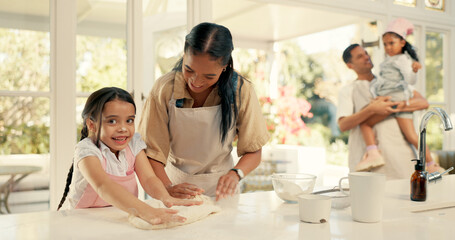 Baking, dough and a woman teaching her daughter about cooking in the kitchen of their home...
