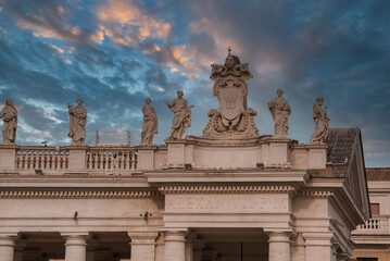 Architectural ensemble in Vatican City, possibly St. Peter's Square. Sunrise or sunset lighting...