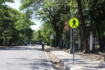 View of a street in Manila with walking sign on March 28, 2024