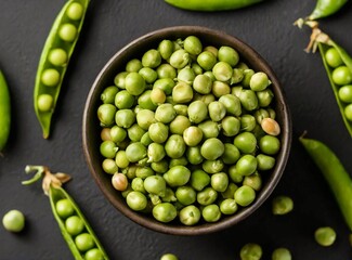 Shelled green peas in a bowl. Healthy food. Top view. isolated on dark black background.
