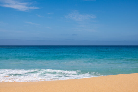 Landscape view of sand and ocean, and blue sky - Powered by Adobe