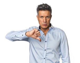 Middle-aged Latino man showing a dislike gesture, thumbs down. Disagreement concept.