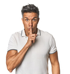 Middle-aged Latino man keeping a secret or asking for silence.